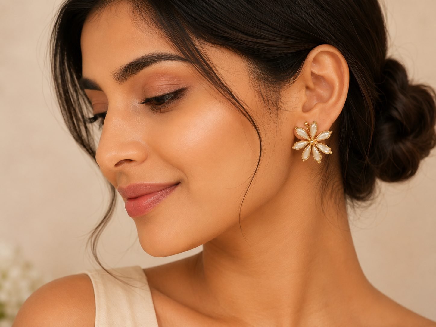 Woman wearing Afreyn Jewels floral pearl earrings